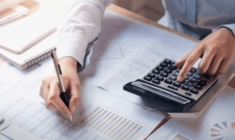 finance accounting concept business woman working desk using calculator