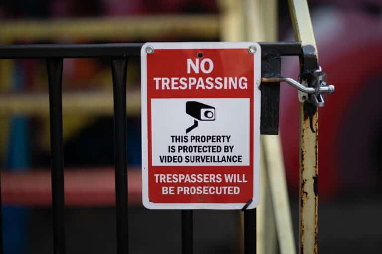 closeup shot of a no trespassing warning red sign 2023 01 10 03 23 23 utc scaled