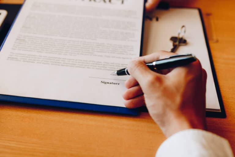 hand client signing contract paper a real estate o 2022 12 16 03 34 07 utc scaled